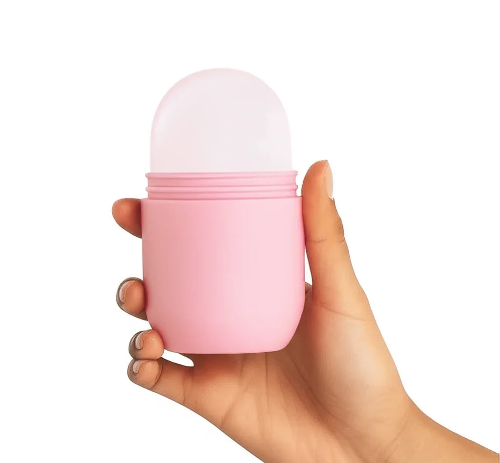 Hand holding a pink cylindrical container with a white top on a white background
